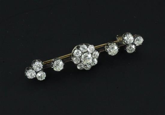 A late Victorian gold, silver and diamond cluster bar brooch, 1.75in.